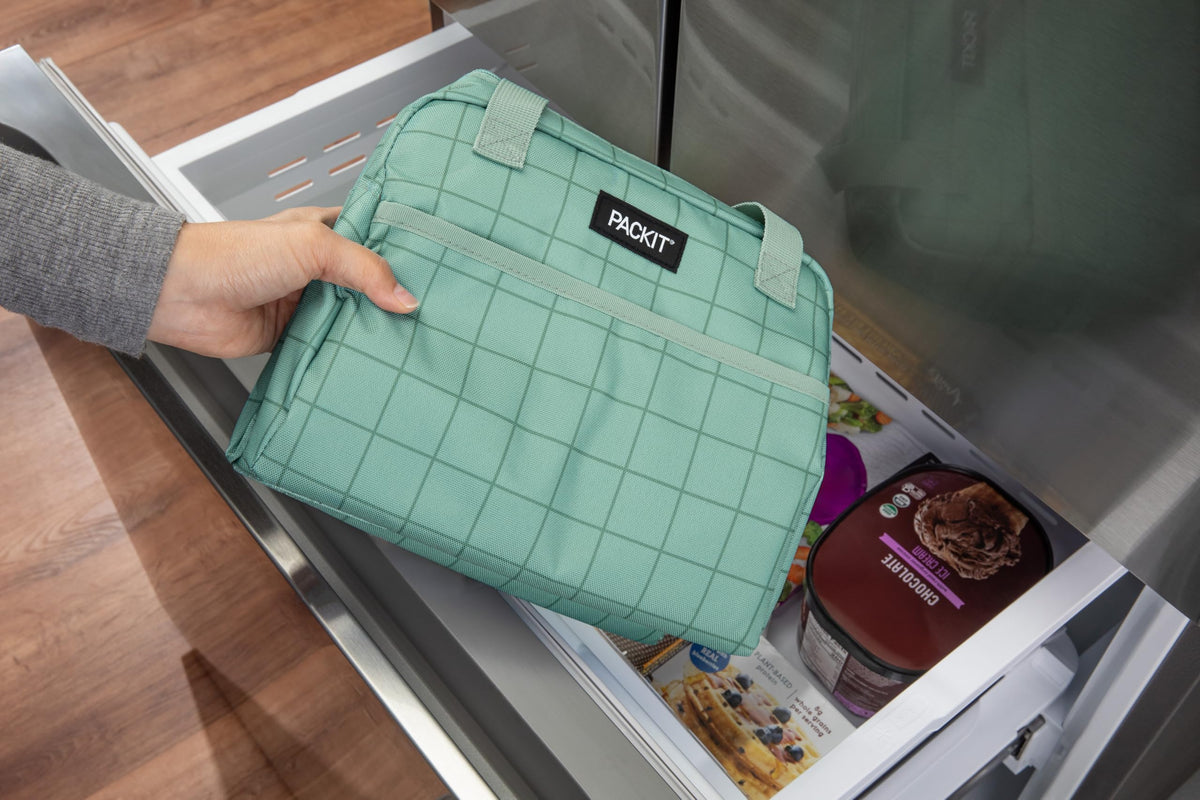 PackIt®️ Freezable Hampton Lunch Bag, Sports Grid Sage, Built with ECOFREEZE® Technology, Collapsible, Reusable, Zip Closure with Front Pocket and Shoulder Straps, Designed for Fresh Office Lunches